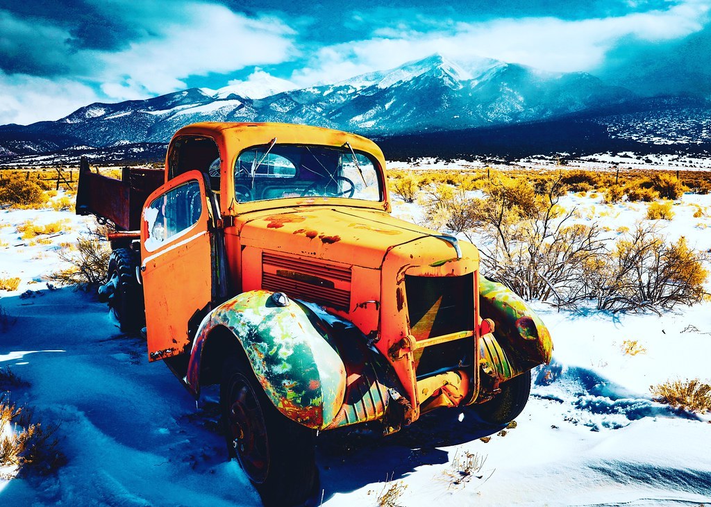 Old truck parked near Great Sand Dunes in Colorado.