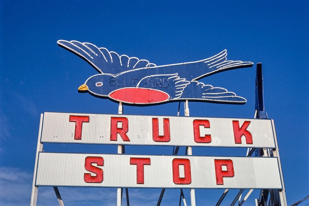 Vintage Blue Bird Truck Stop sign.